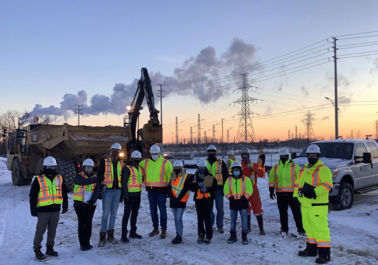 Sterling Ridge Group workers posing on construction site wearing masks