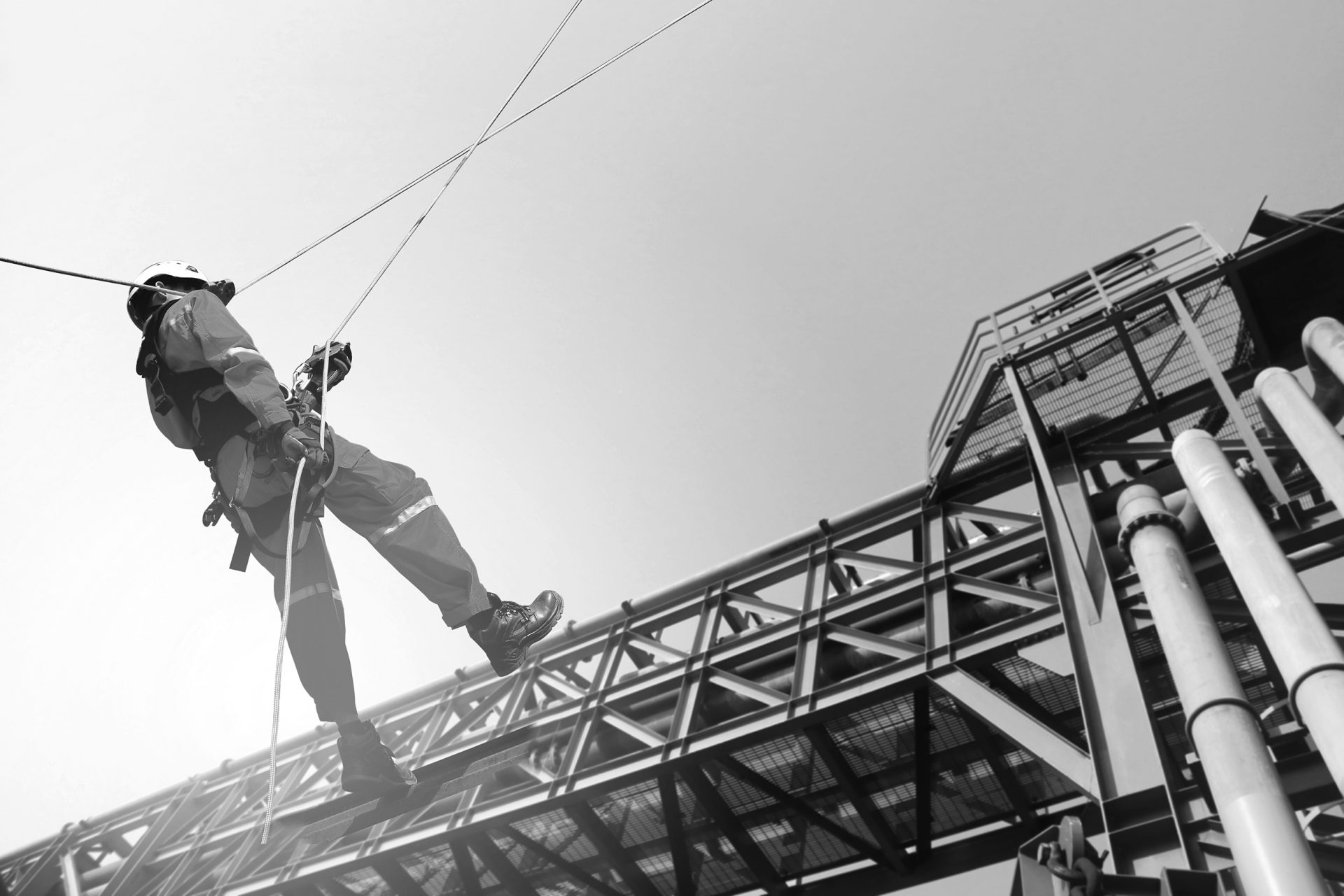 construction worker propelling off side of building