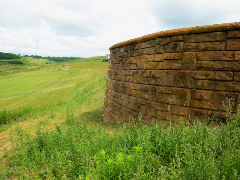 precast concrete block wall on golf course