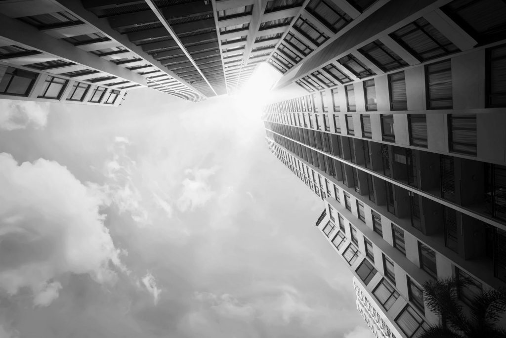 view looking up at tall apartment building