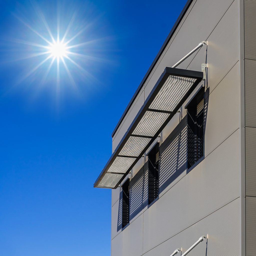 passive house designed building with outer window shade shutters