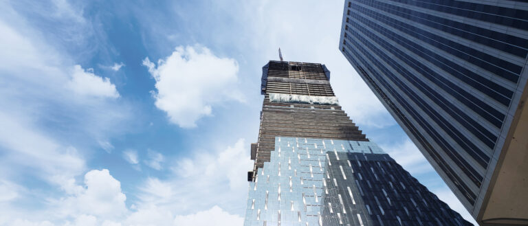 skyscrapers under construction with blue sky