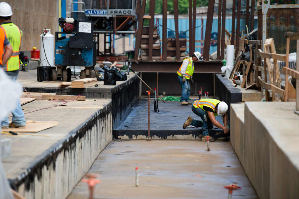 contractors pouring asphalt