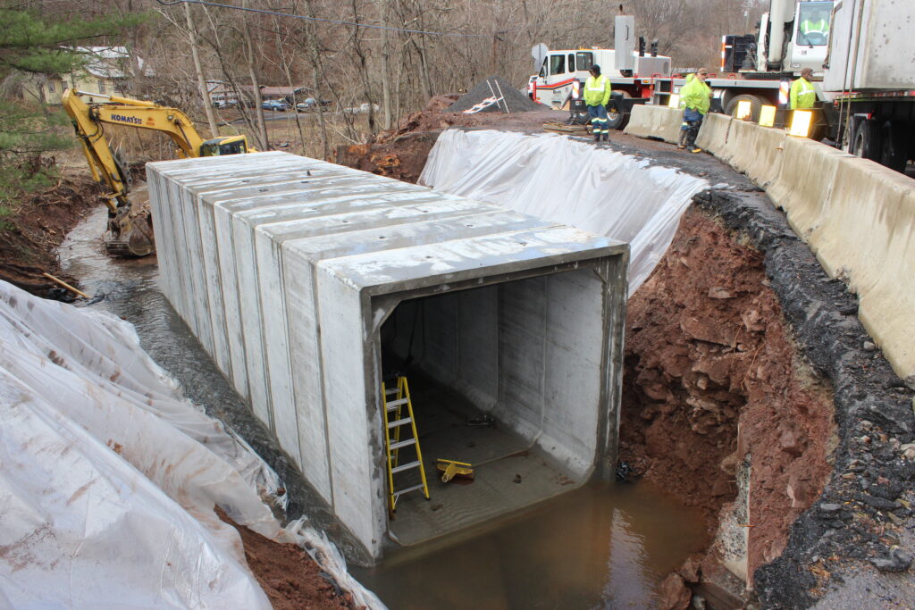 Evercast team installing concrete box