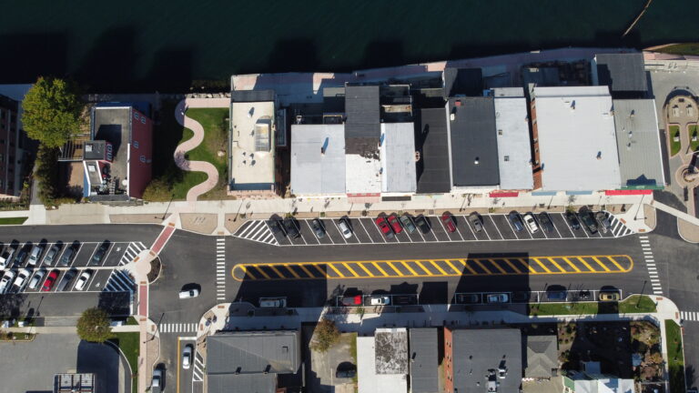 Luck Bros project aerial view of road next to lake