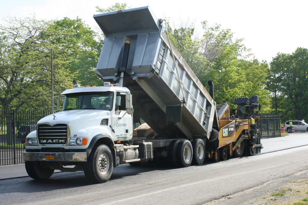 Occhino dump truck loading asphalt