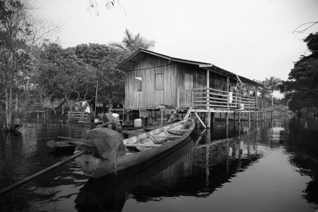 houses on stilt to sit above water level in indonesia