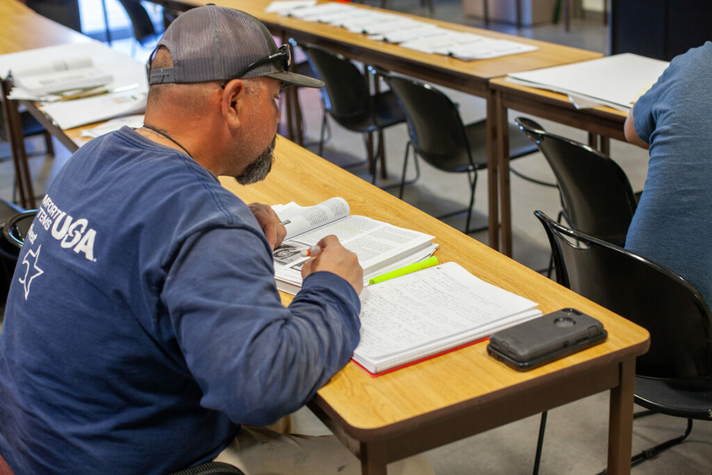 ABCNM student studying at desk