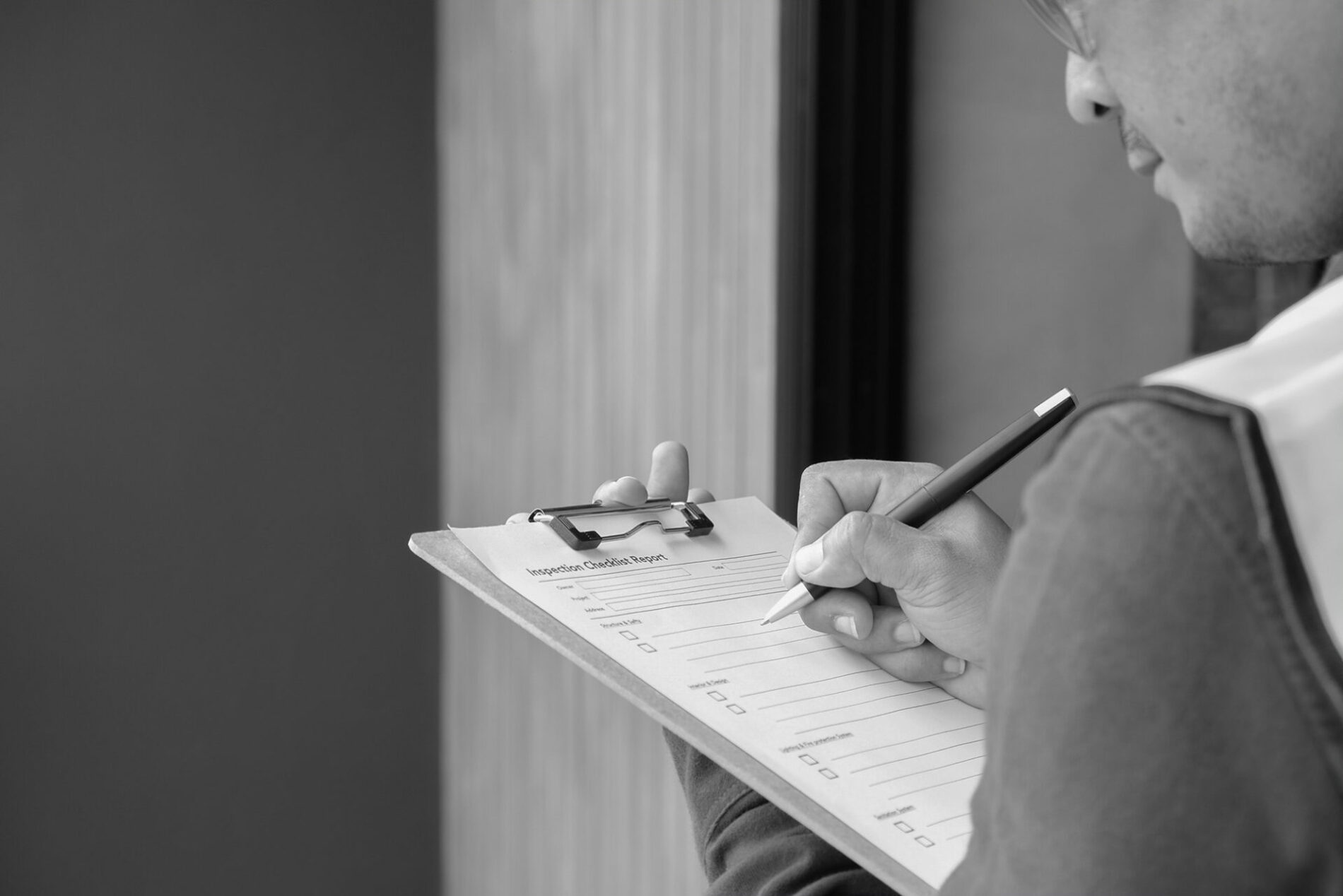 checklist in hand of construction industry worker