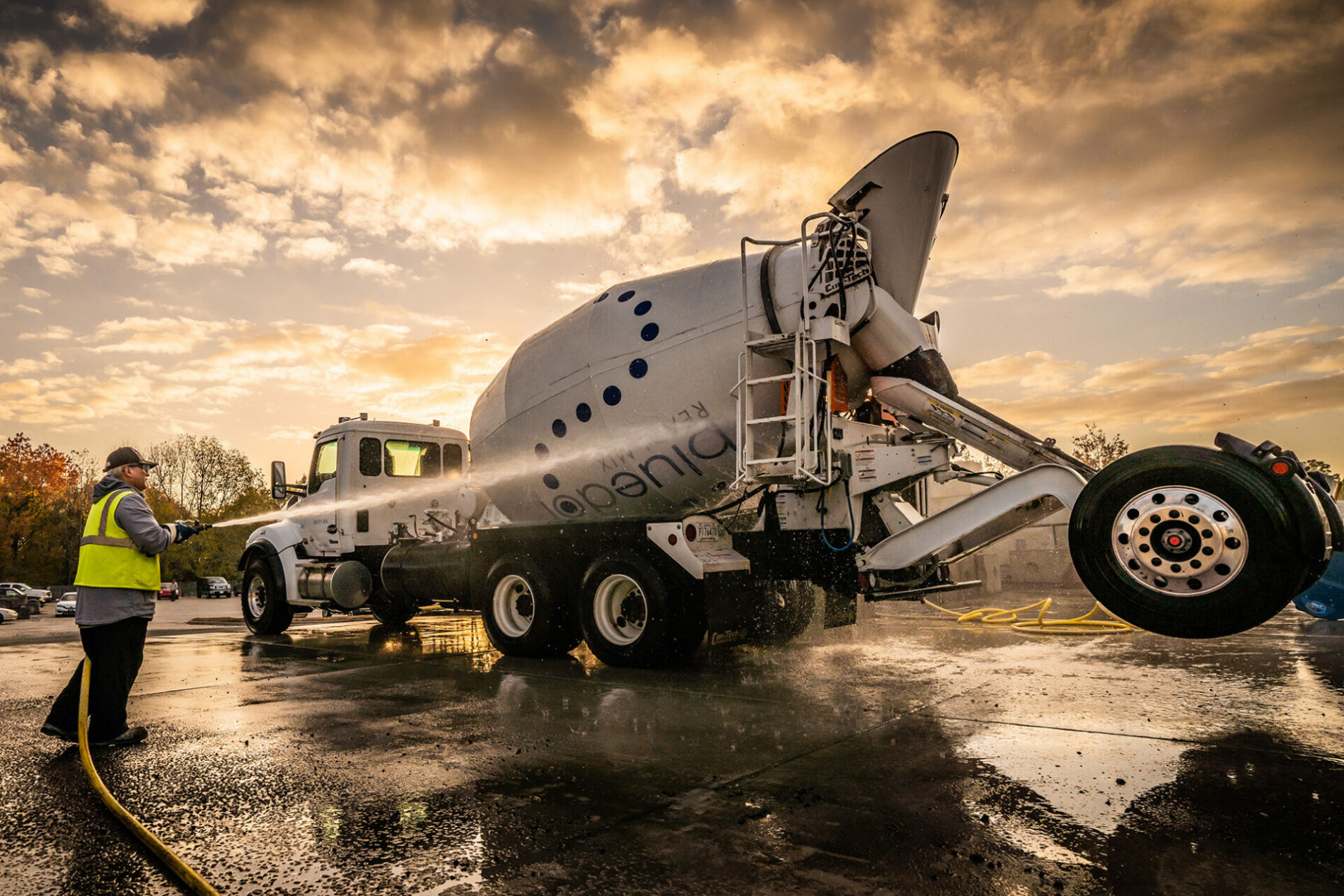 Blue Dot Readi-Mix truck being sprayed down and cleaned