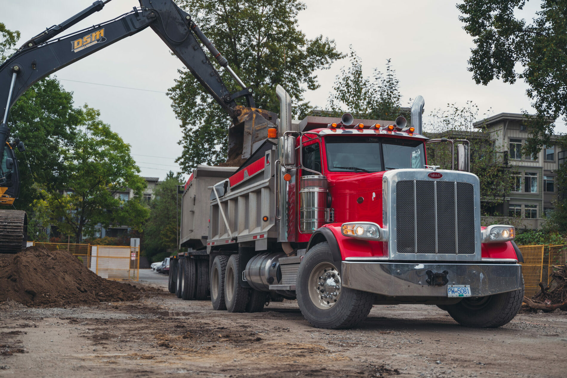 DSM red dump truck on jobsite