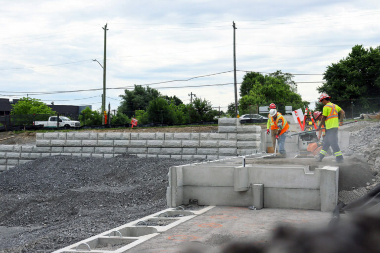 Construction site with workers wearing safety equipment