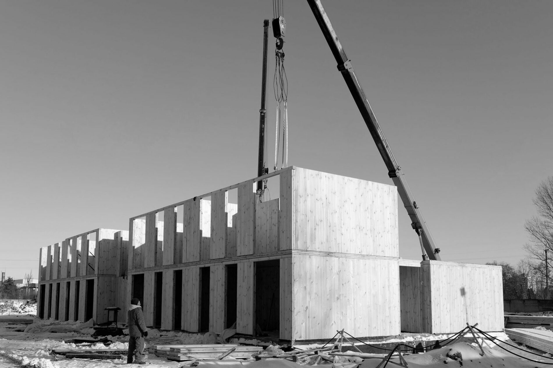 The construction process of a new and modern modular house made of composite sip panels on a sunny winter day.